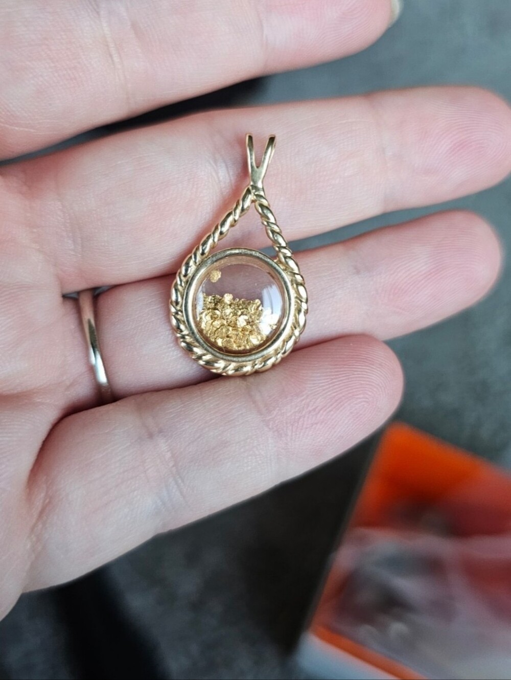 14k gold pendant with high karat gold inside. Back stamped 14k. More info in pic